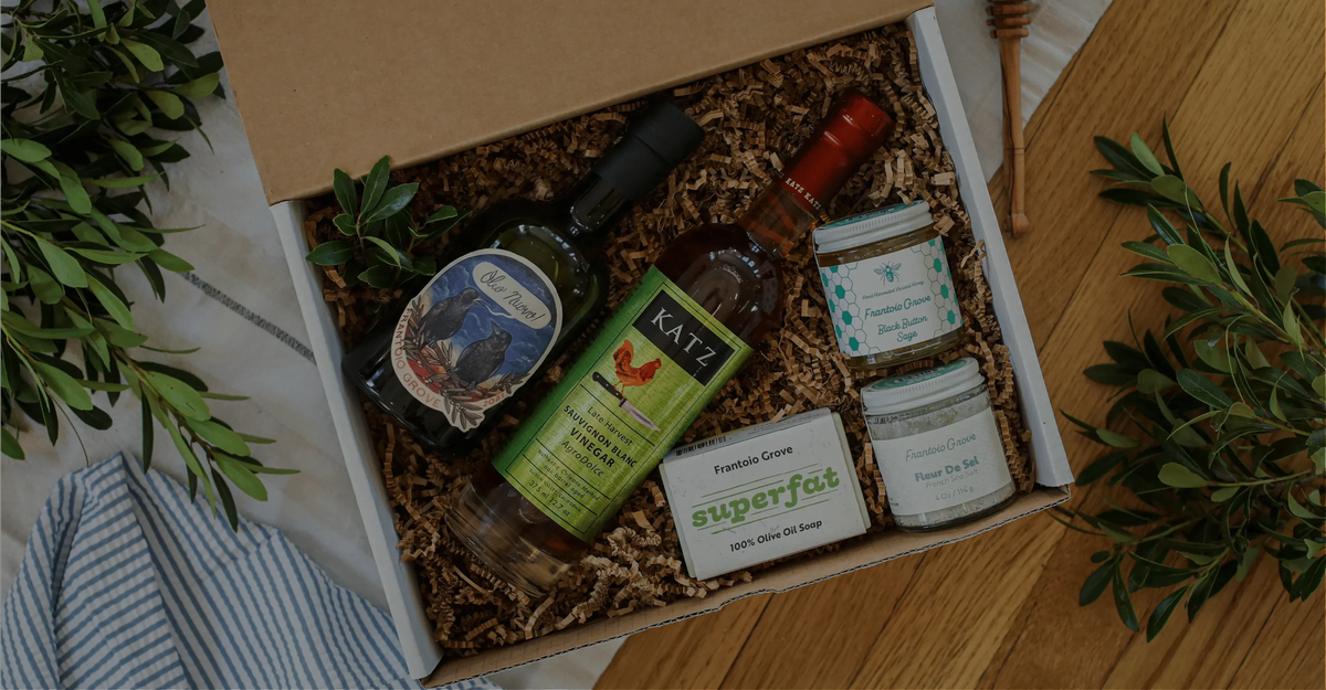 Frantoio Grove olive oil gift set arranged in a hand-stamped gift box