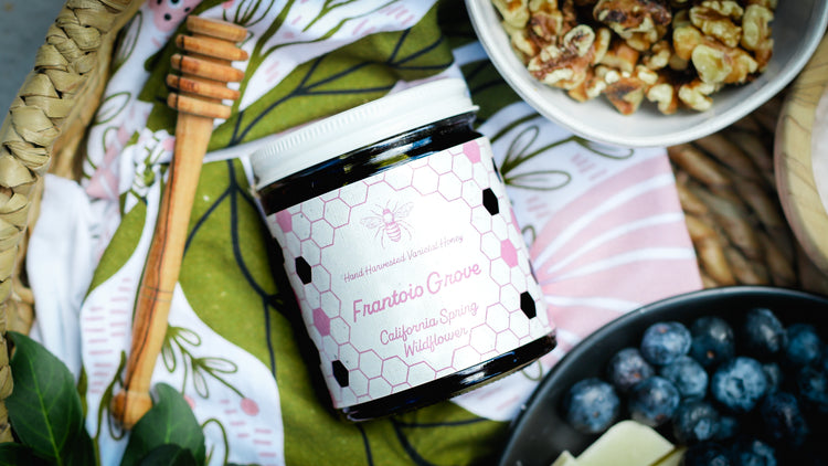 A Jar Of California Spring Wildflower Honey In A Basket With Blueberries And Walnuts