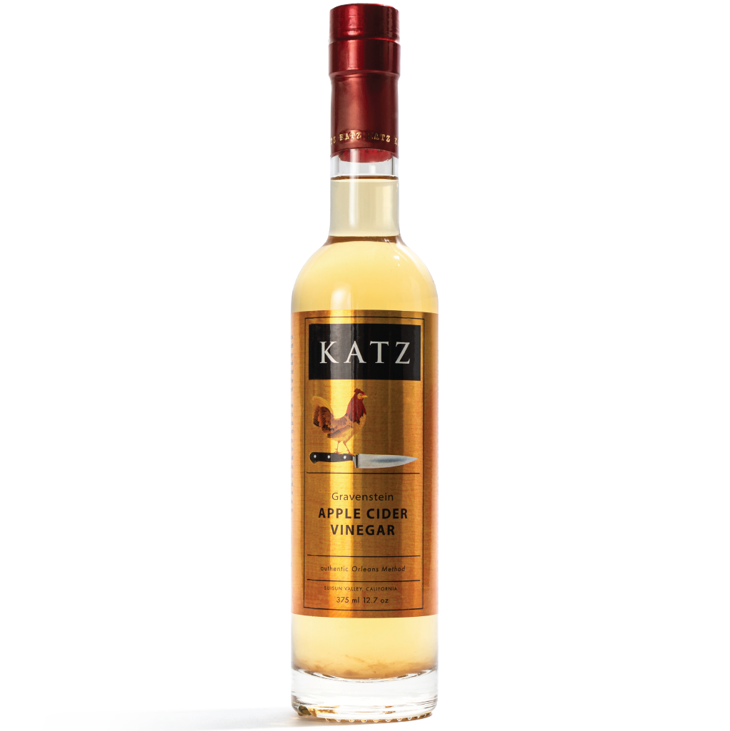 Bottle of KATZ Gravenstein Apple Cider Vinegar on a transparent background.