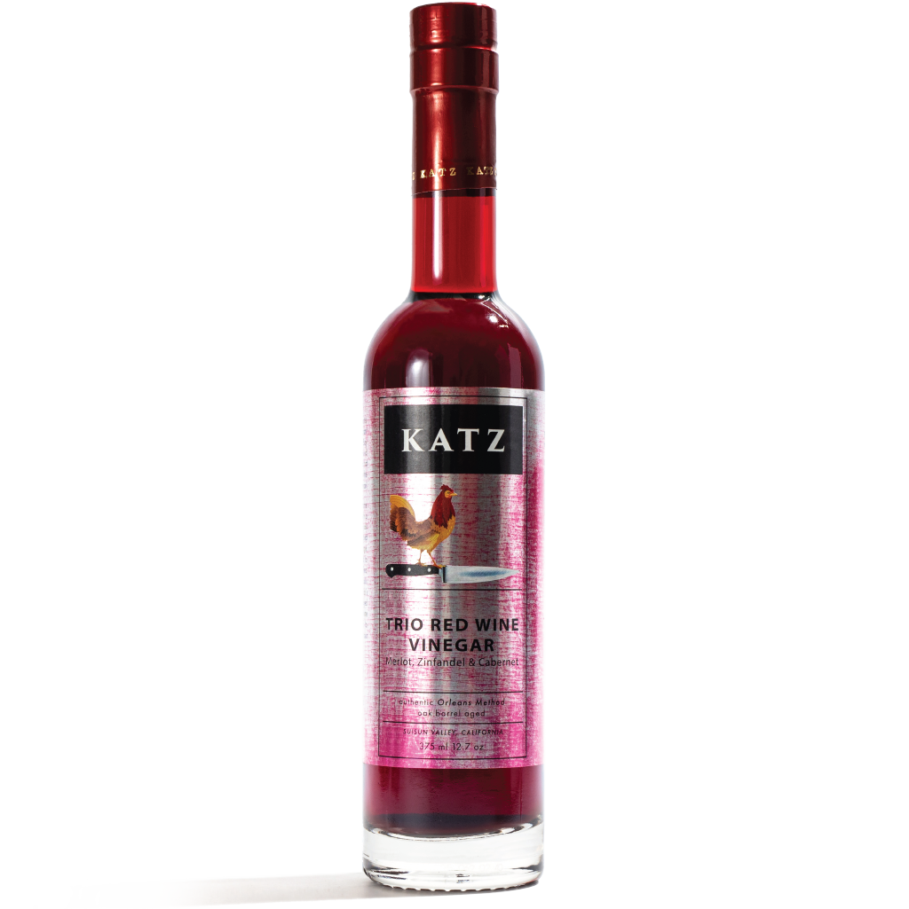 Bottle of KATZ Trio Red Wine Vinegar on a transparent background.