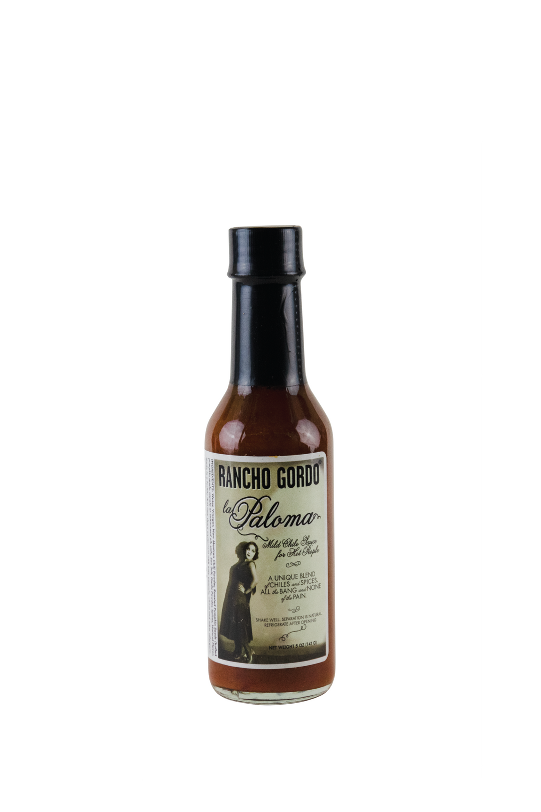 Image of a 5 oz glass bottle of Rancho Gordo La Paloma hot sauce on a white background. Label art is of a woman with dark, curly hair, who looks like she comes from the 1920s. Additional text on bottle reads: Mild chile sauce for hot people. A unique blend of chiles and spices, all the bang and none of the pain. Shake well, separation is natural, refrigerate after opening.