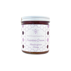 Northwestern Meadowfoam Honey jar with honeycomb pattern label in purple and white, featuring bee logo on glass container