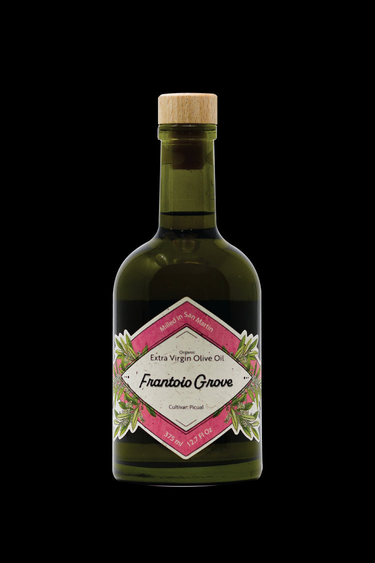 An Image Of A 375 ml/12.7 Fl Oz bottle of Frantoio Grove's Organic Picual Extra Virgin Olive Oil on a white background. The pink and white label is diamond-shaped with olive blossoms and leaves. Additional text on label reads: Milled in San Martin. Organic Extra Virgin Olive Oil. Cultivar: Picual.