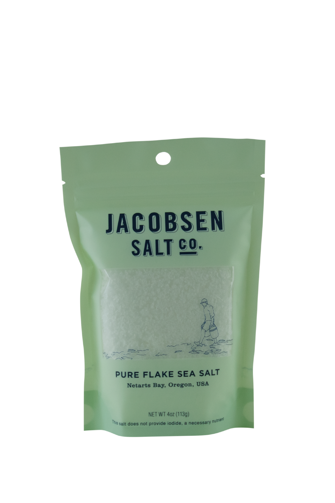 A 4 Oz Pouch Of Jacobsen salt Co's Pure Flake Sea Salt In A Celeste Green Pouch and a Clear Window Showing the Texture Of The Salt. Label says, "This salt does not provide iodide, a necessary nutrient."