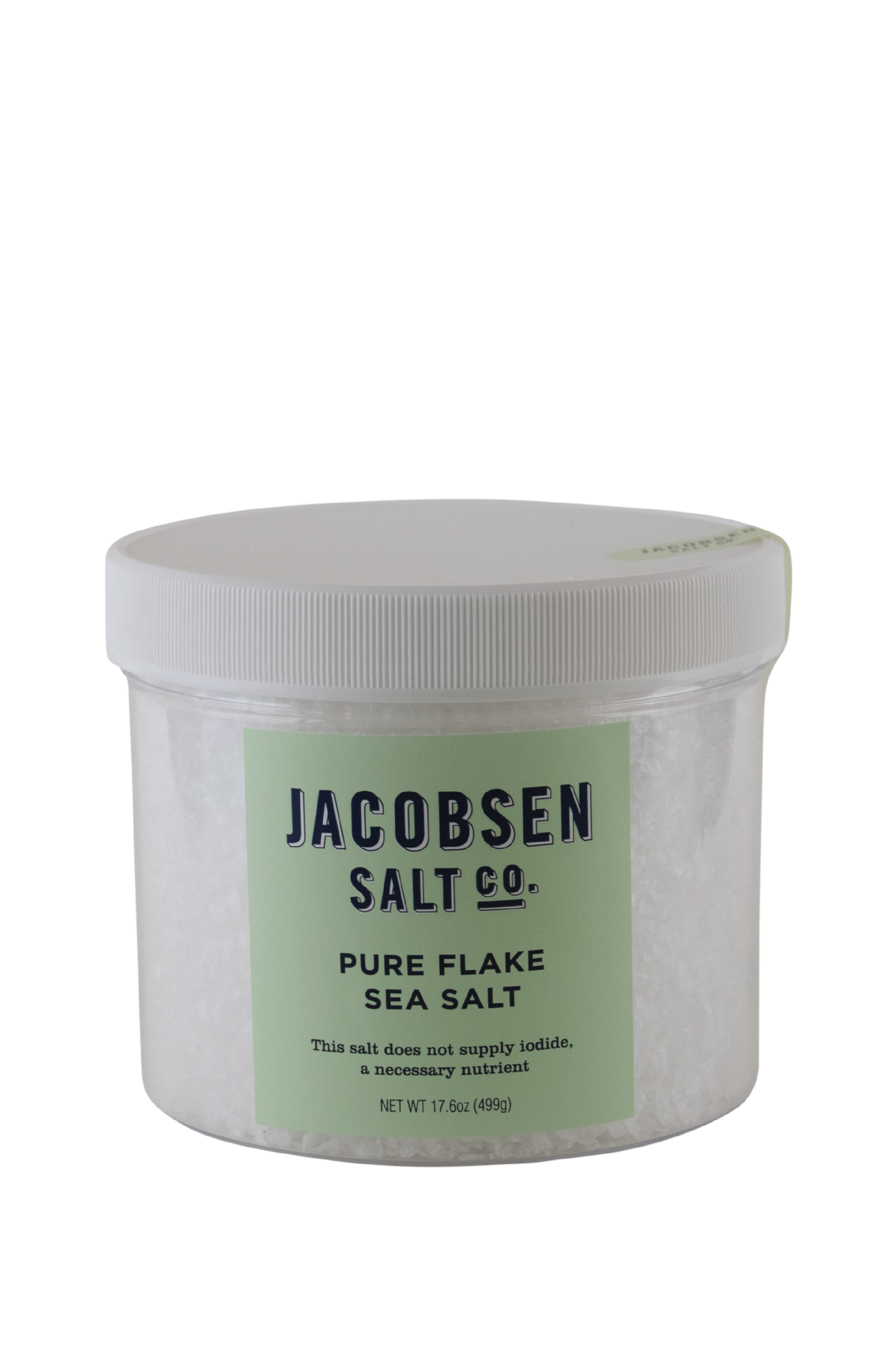 A Large Plastic Jar Of Jacobsen Salt Co's Pure Flake Sea Salt With Celeste Green Label and White Background. Label says "This salt does not supply iodide, a necessary nutrient."