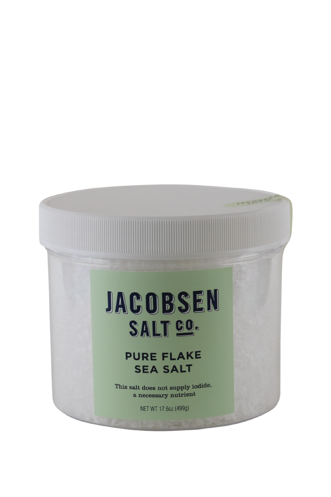 A Large Plastic Jar Of Jacobsen Salt Co's Pure Flake Sea Salt With Celeste Green Label and White Background. Label says "This salt does not supply iodide, a necessary nutrient."