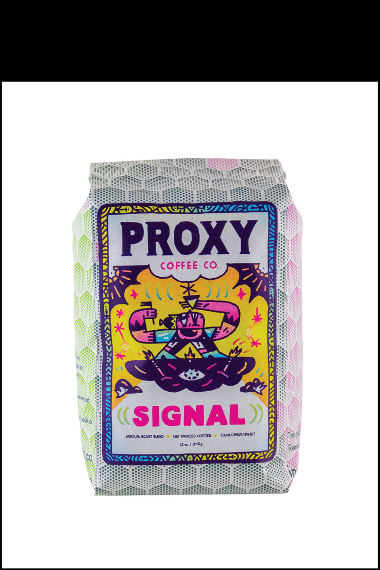 Photograph of a 12 oz/340g bag of Proxy Coffee Co.'s Signal medium roast Signal blend on a white background.