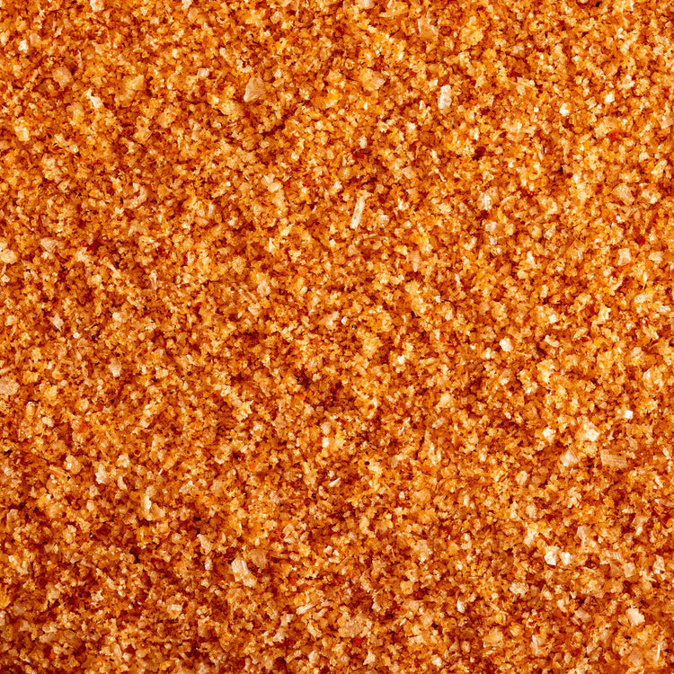 A Closeup of Habanero Salt, showing the course texture and rich orange color.